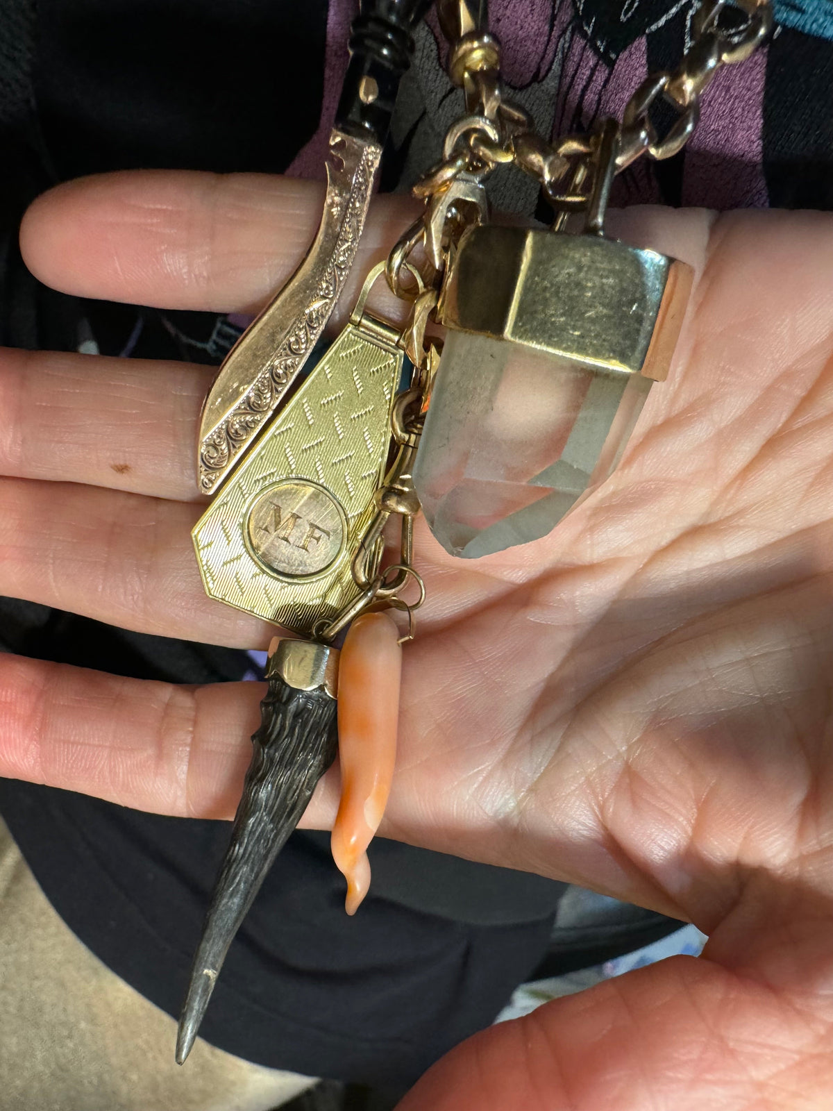 a collection of antique charms collected by Karen Yost and made into Anomaly Relic.