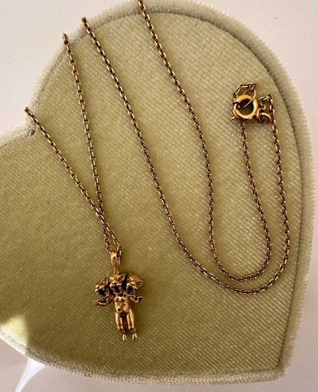 Close-up of three panther faces on 14K gold charm pendant, Anomaly Relic