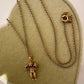 Close-up of three panther faces on 14K gold charm pendant, Anomaly Relic