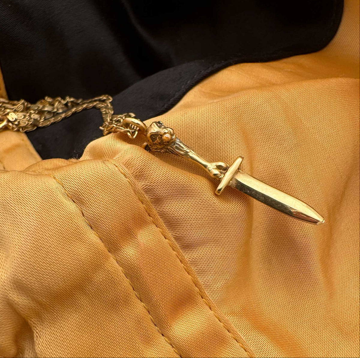 14K gold lamb and bone sword necklace