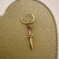 14K yellow gold lamb with sword and bones sculptural charm hanging from gold hoop earring, Anomaly Relic House Relic Collection