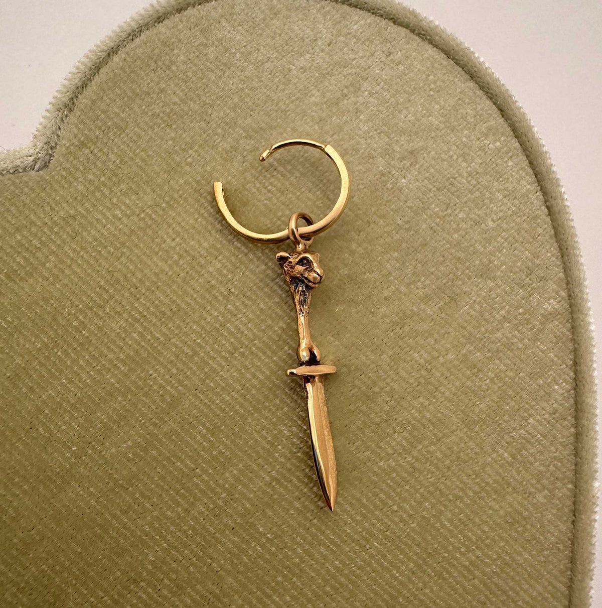 14K yellow gold lamb with sword and bones sculptural charm hanging from gold hoop earring, Anomaly Relic House Relic Collection