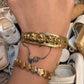 Hand-crafted 14K gold cuff with original baby head motif by Karen Yost, NYC. Collector-grade fine jewelry. Adjustable. Small batch.
