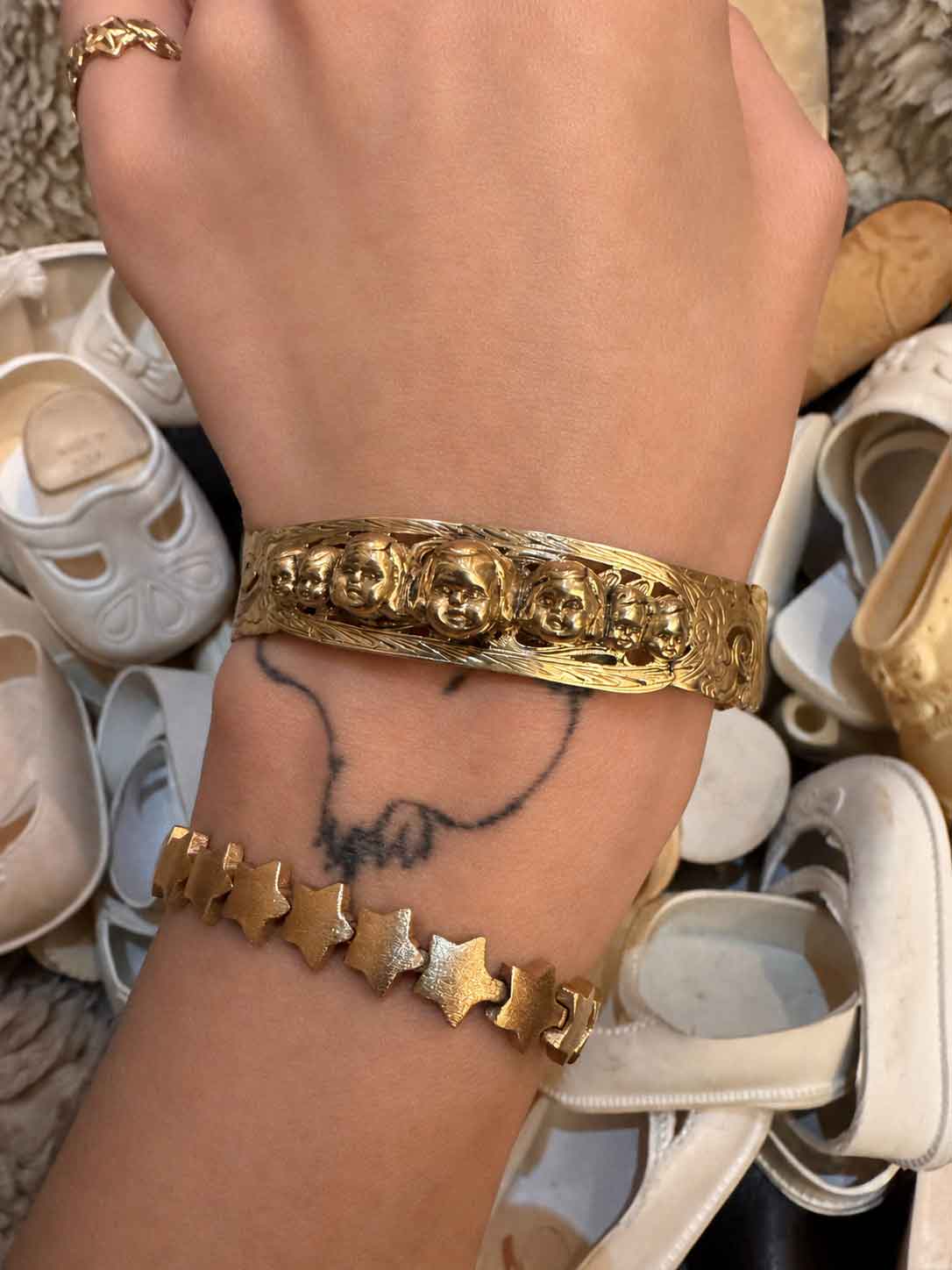 Hand-crafted 14K gold cuff with original baby head motif by Karen Yost, NYC. Collector-grade fine jewelry. Adjustable. Small batch.