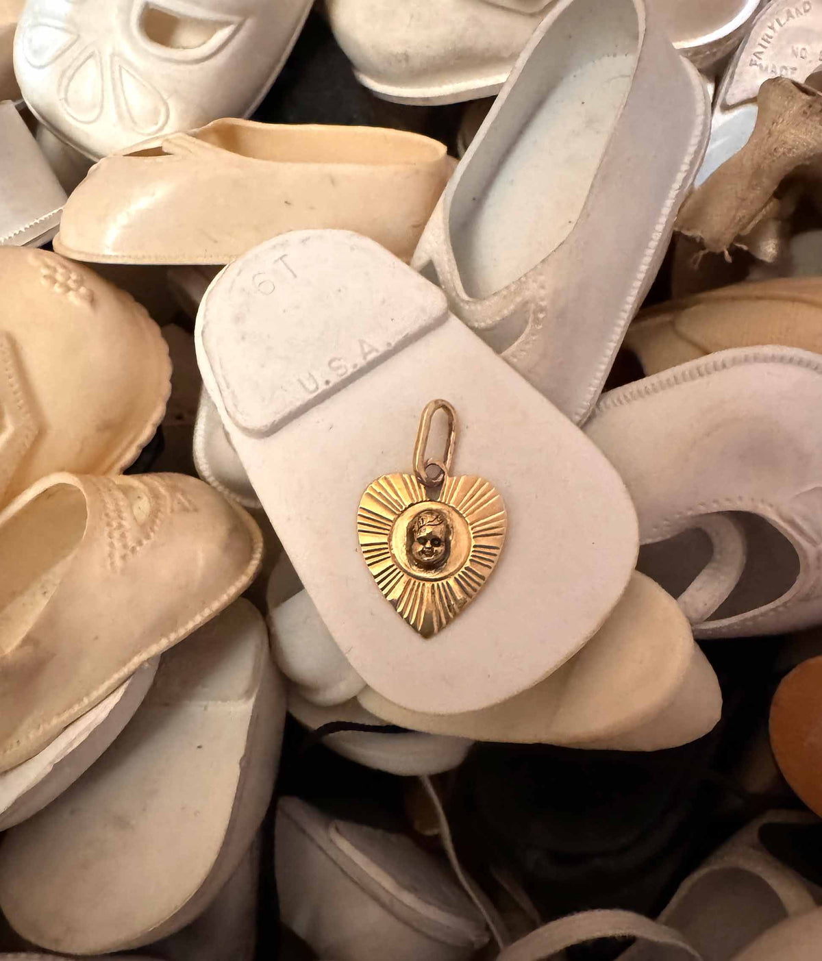 Vintage engine-turned gold heart charm with hand-sculpted baby head and black diamond eyes, one of a kind, Anomaly Relic Reliquary Collection NYC