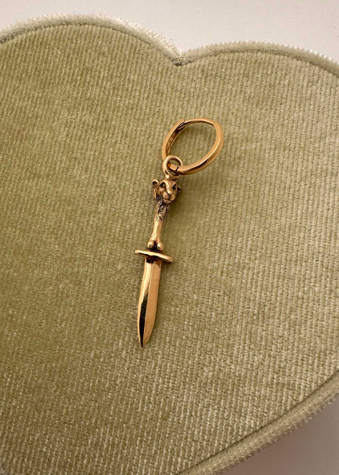 14K yellow gold lamb with sword and bones sculptural charm hanging from gold hoop earring, Anomaly Relic House Relic Collection