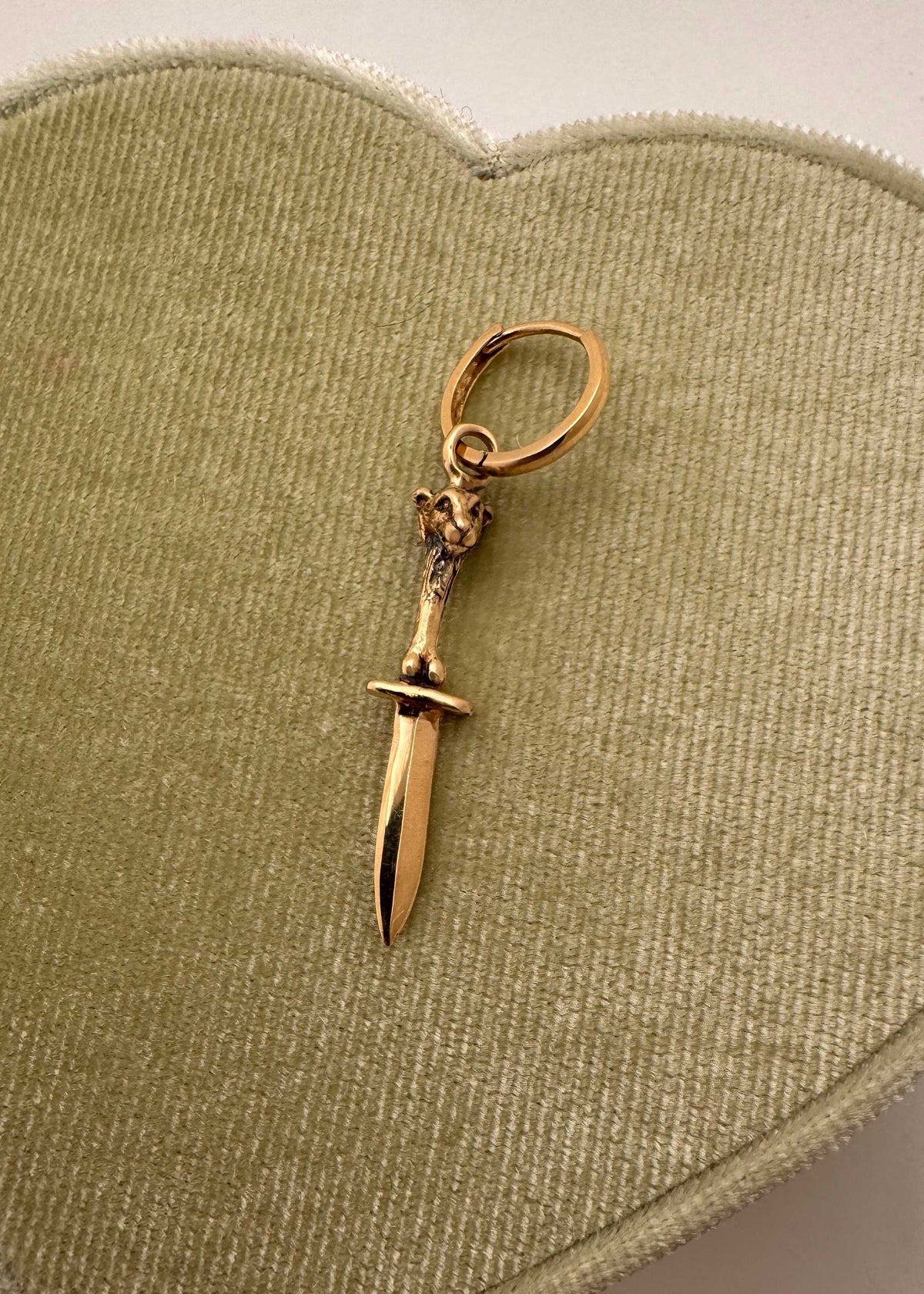 14K yellow gold lamb with sword and bones sculptural charm hanging from gold hoop earring, Anomaly Relic House Relic Collection