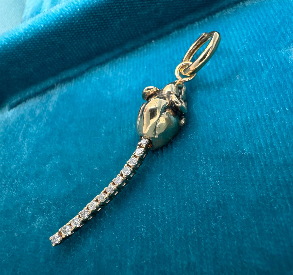 Hand-sculpted 14K gold rat charm with articulated segmented vintage diamond eternity bracelet tail, photographed on dark velvet showing full body and tail movement