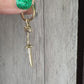 video of 14K lamb bones and sword earring in 14K gold by anomaly Relic. made by hand in New York City